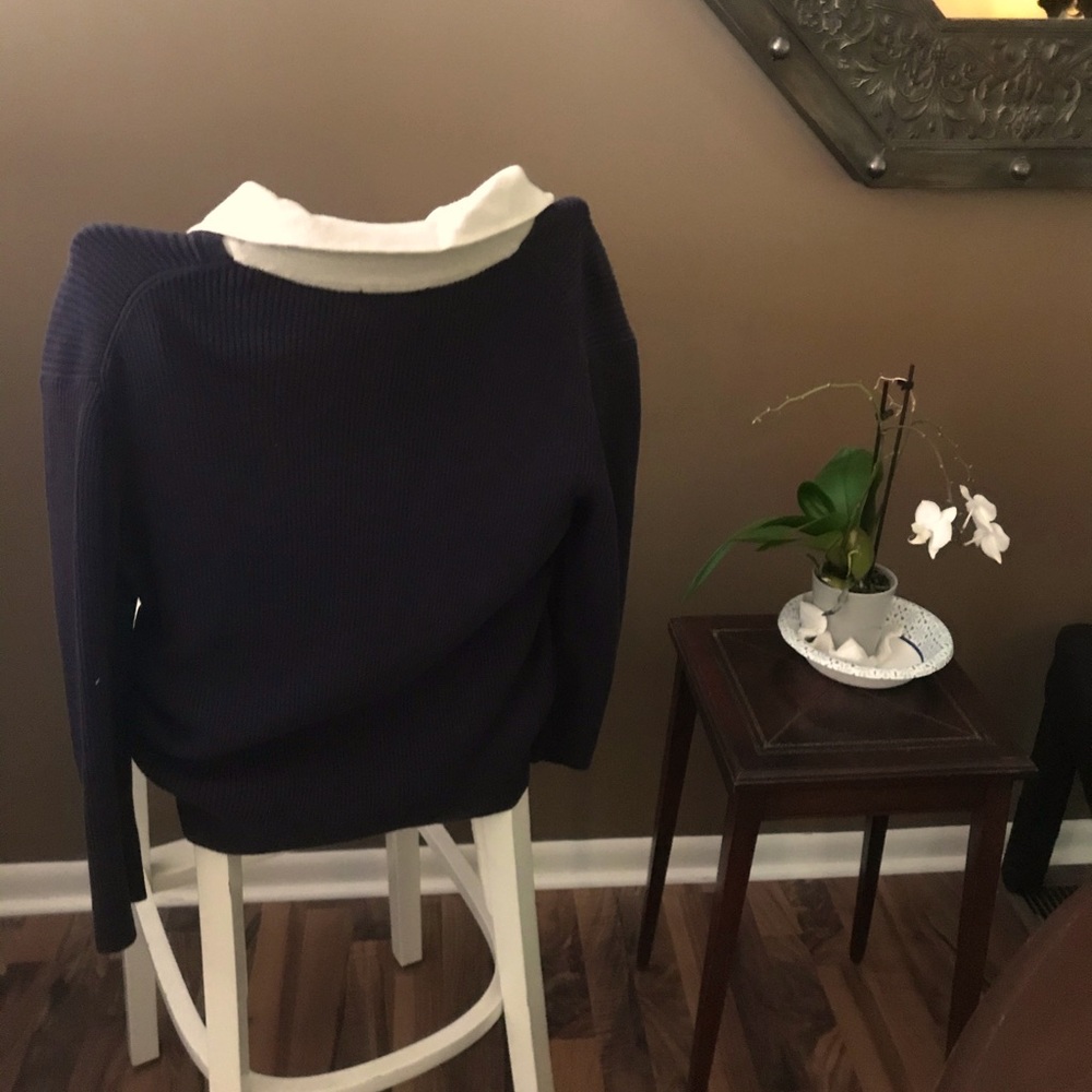 The crew neck false button down top; clean look